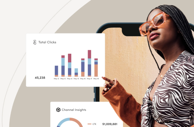Creator using her phone beside content analytics